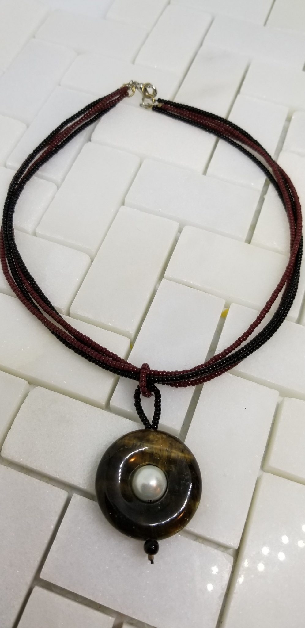 Tiger eye pendant with stringed chain